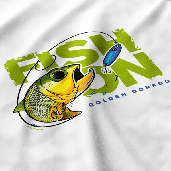 close up of back of fish on tshirt with golden dorado striking a spoon lure